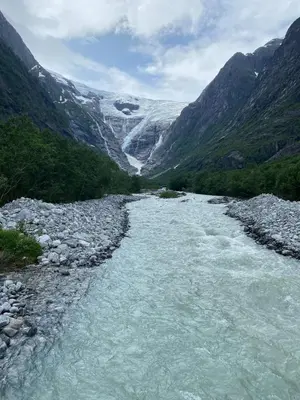 a river in the middle of a mountain at Faleide View in Stryn