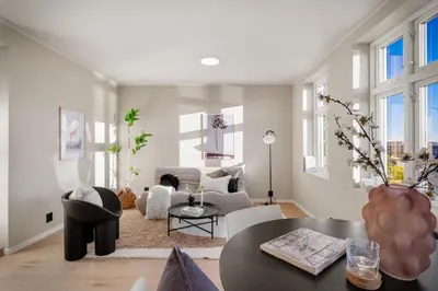 a living room with a couch and a table at Stay Panorama - Best view in Bergen l Studio in Bergen