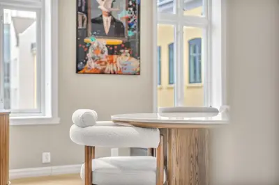 a dining room with a table and two chairs at Urban Elegant Apartment in Bergen