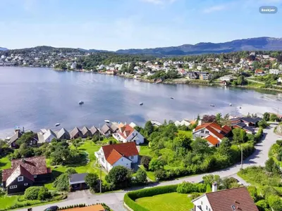 an aerial view of a town next to a river at Short way to city centre and Aker Solutions! in Stord
