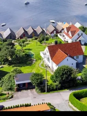 an aerial view of a row of houses near the water at Short way to city centre and Aker Solutions! in Stord