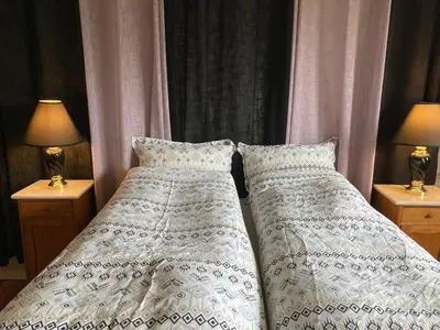two beds sitting next to each other in a bedroom at Short way to city centre and Aker Solutions! in Stord