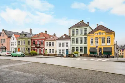 a row of colorful houses on a city street at Historic Townhouse I With Rooftop & Free Parking in Bergen