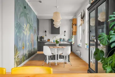 a kitchen and dining room with a table and chairs at Historic Townhouse I With Rooftop & Free Parking in Bergen