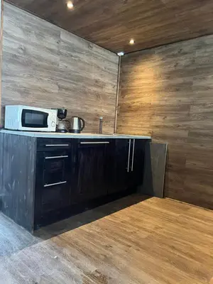a kitchen with a microwave on top of a counter at Dokka Motell in Dokka