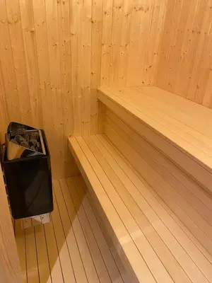 a inside of a sauna with a trash can at Ski in and ski out in the middle of the slopes in Favang