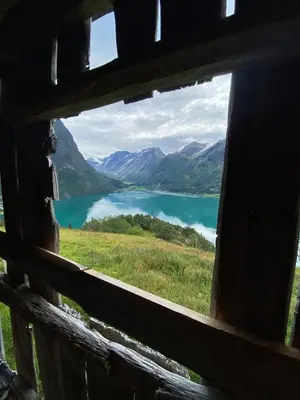 a view of a lake from a window of a building at Cabin by Oppstrynsvatnet, Hjelle in Stryn
