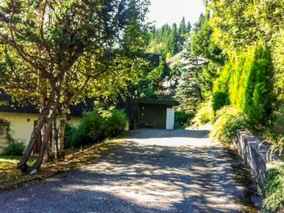 a driveway leading to a garage in a yard at 7 person holiday home in Molde in Molde