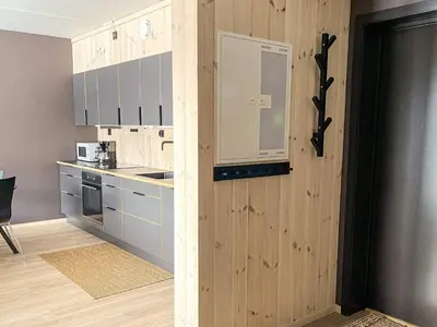 a kitchen with blue cabinets and a counter top at 4 star holiday home in Hemsedal in Hemsedal