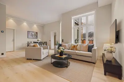 a living room with a couch and a table at Rosenberg Apartments in Bergen