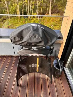 a bag sitting on a chair in front of a window at Luxury apartment with beautiful location in Florvåg