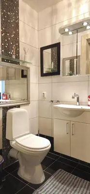 a bathroom with a white toilet and a sink at Øvregaten in Bergen