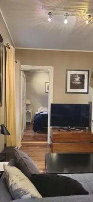 a living room with a couch and a television at øvregaten in Bergen