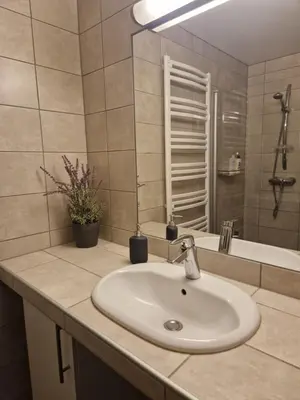 a bathroom with a sink and a bath tub at Storehorn Apartments Hemsedal in Fausko