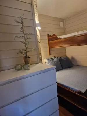 a bedroom with a bunk bed in a tiny house at Storehorn Apartments Hemsedal in Fausko