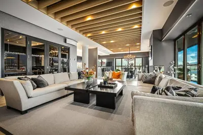 a living room with couches and a coffee table at Exclusive Penthouse with Bryggen Views I MUST SEE in Bergen