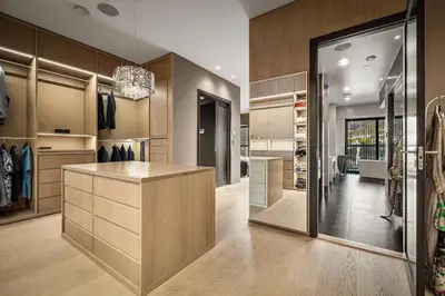 a large dressing room with a counter and a glass door at Exclusive Penthouse with Bryggen Views I MUST SEE in Bergen