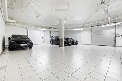 a garage with two cars parked in it at Exclusive Penthouse with Bryggen Views I MUST SEE in Bergen