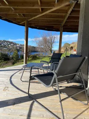 a group of chairs sitting on a patio at Sjøutsikt in Bergen