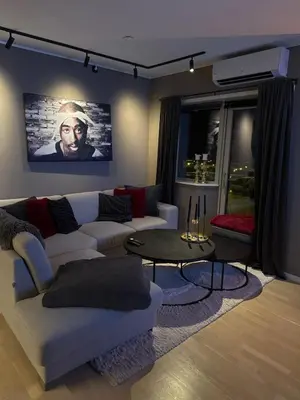 a living room with a couch and a table at 3-room downtown apartment in Trondheim