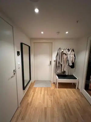 a room with a coat hanging on a wall at Centrally located apartment in Bergen