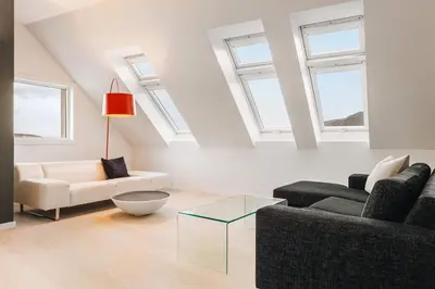 a living room with two couches and a glass table at DINBNB Apartments l Luxury Penthouse l Roof Terrace l Central Bergen in Bergen
