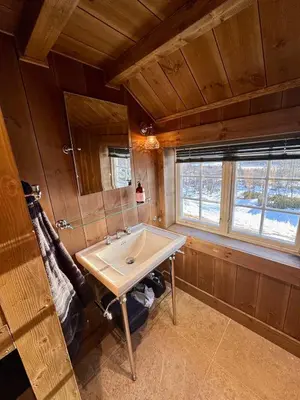 a bathroom with a sink and a window at The Heritage Lodge - Geilo in Geilo