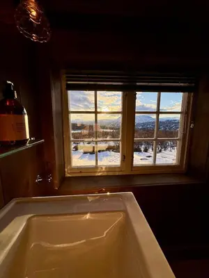 a bath tub in a bathroom with a window at The Heritage Lodge - Geilo in Geilo
