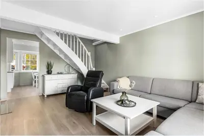 a living room with a couch and a table at Hus i Verdal med 3 soverom in Verdal