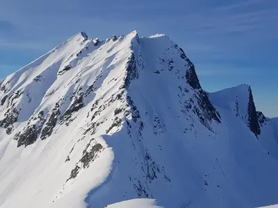 a mountain covered in snow on a clear day at Hytte Blåtind, Rekkedal Gjestegard - Sæbø in Sæbø