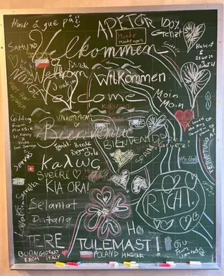 a chalkboard with lots of writing on it at Knirkenheimen in Trondheim
