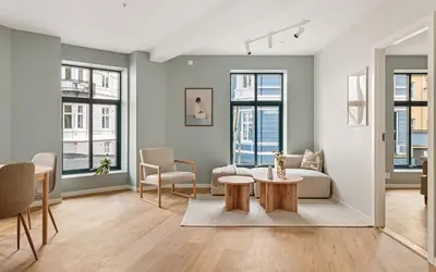 a living room with a couch and a table at HH - Modern Apartments l City Center in Bergen