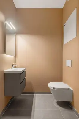 a bathroom with a toilet and a sink at HH - Modern Apartments l City Center in Bergen