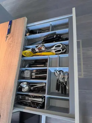 a drawer filled with lots of different types of scissors at New apartment by the fjord in Stadlandet