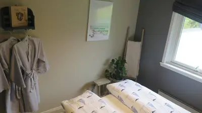 a room with two beds and a window at Sara's Fjord View House in Stadlandet