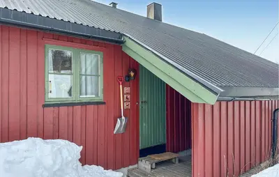 a red house with a green door and a window at Awesome Apartment In Rauland in Rauland