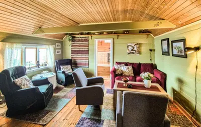 a living room with a couch and chairs and a table at Nice Home In Valen With House Sea View in Valen