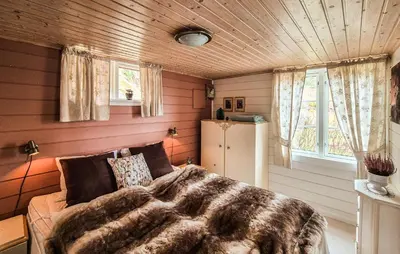 a bedroom with a bed in a room at Nice Home In Valen With House Sea View in Valen