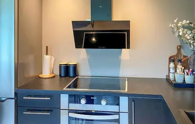 a kitchen with a sink and a stove at 1 Bedroom Gorgeous Apartment In Kvisvik in Kvisvik
