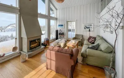 a living room with a couch and a fireplace at Lovely Home In Aurdal With Sauna in Aurdal