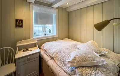 a small bedroom with a bed and a window at Lovely Home In Aurdal With Sauna in Aurdal