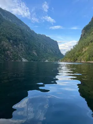 a view of a river between two mountains at Hylen in Kvilldal