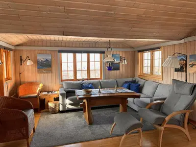 a living room with a couch and a table at A Peaceful Mountain Retreat in Beitostøl