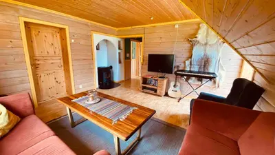 a living room with a couch and a table at Sognefjorden-Vik i Sogn in Brekka