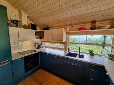 a small kitchen with a sink and a window at Bright Cabin In Eggedals Beautiful Mountains in Eggedal