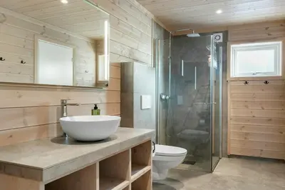 a bathroom with a sink and a toilet and a shower at Modern Mountain Cabin Near Norefjell in Eggedal