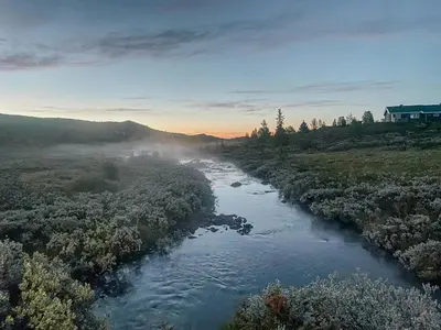 an aerial view of a river in a field at Traditional Mountain Cabin Near Hallingskarvet in Torpo