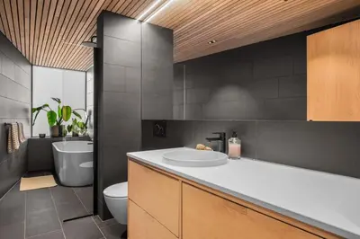 a bathroom with a white sink and a toilet at Stay in The Hollywood Hills of Bergen with Breathtaking Views in Bergen