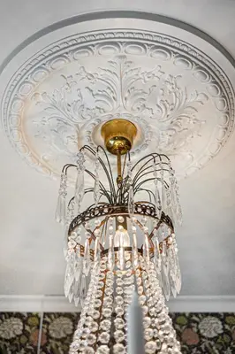 a chandelier hanging from a ceiling at Jugend 1904 in Ålesund