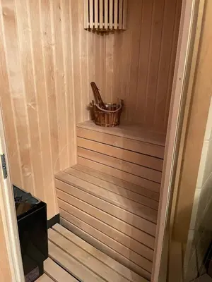 a wooden stairway with a tub in a room at Ski in & out hytte på Lemonsjøen i Jotunheimen in Randsverk